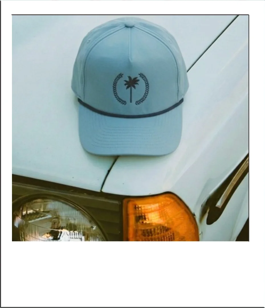 A Palm Republic cap on the hood of a truck